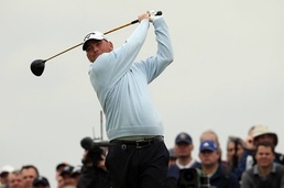 Thomas Bjorn watches his drive from the 18th tee All eyes on Lewis, Bjorn in British Open 2nd round