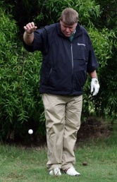 John Daly takes a penalty shot after smashing a fan's camera against a tree Daly smashes fan's camera in golf tournament rage