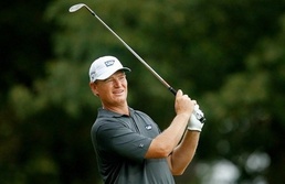 Els surges to victory in Grand Slam of Golf