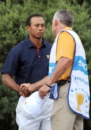 US golfer Tiger Woods (L) shakes hands with former caddie Steve Williams in Melbourne Ex-caddie slams Tiger Woods over affairs