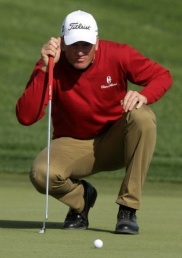 Golfer Karlsson on top in windy Qatar