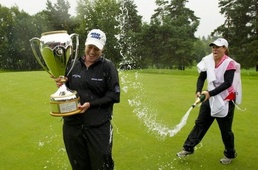 Brittany Lincicome gets sprayed with champagne by her caddie A. J. Eathorne Lincicome wins LPGA Canadian crown