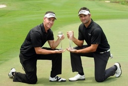 Paddison (left) sank the bunker shot at the 18th N. Zealand, Singapore, Korea qualify for W. Cup golf