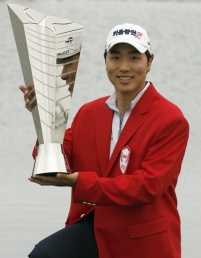 Bae Sang Moon of South Korea poses with winner's trophy S.Korea's Bae wins SK Telecom golf open