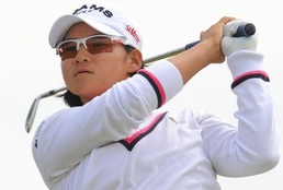 Yani Tseng of Taiwan plays her tee shot to the third during the final round Tseng defends British Open golf title