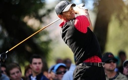 Tiger Woods follows through on a drive Woods ends drought with World Challenge win