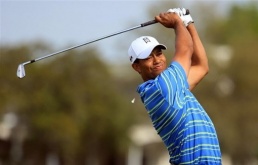 Tiger Woods hits his tee shot on the 14th hole during the first round of the Arnold Palmer Invitatio Woods poised to challenge at Bay Hill golf